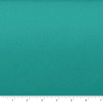 Bali Fresh Solid in teal by Camelot Fabrics, solid quilting cotton with a ruler for scale