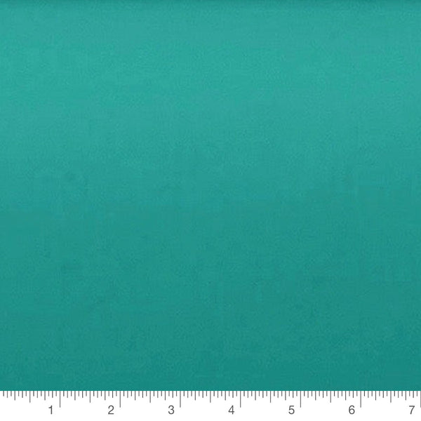 Bali Fresh Solid in teal by Camelot Fabrics, solid quilting cotton with a ruler for scale