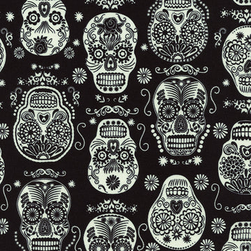 Glow in the Dark Folklore Skulls on Black by Timeless Treasures