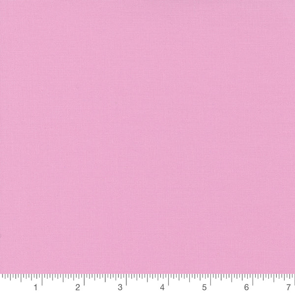 Amelia Pink Bella Solid by Moda, solid pink quilting cotton fabric swatch with inch ruler for scale