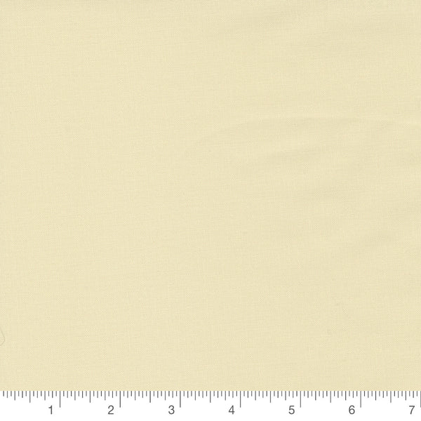 Fig Tree Cream Bella Solid by Moda Fabrics, solid cream quilting cotton fabric swatch with inch ruler for scale