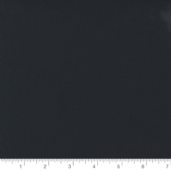 Bella Solid Black by Moda Fabrics, solid black quilting cotton fabric swatch with inch ruler for scale