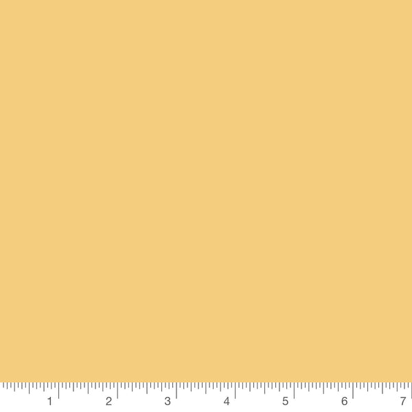 Honey Confetti Cotton solid by Riley Blake, solid quilting cotton with a ruler for scale