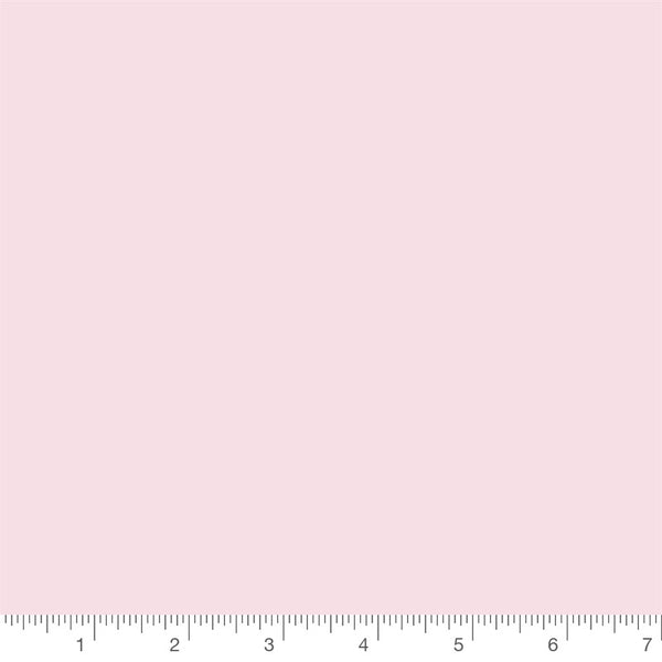 Petal Pink Confetti Cotton solid by Riley Blake Designs, solid quilting cotton with a ruler for scale