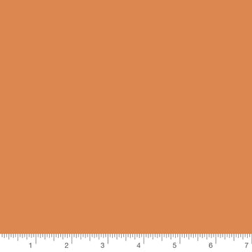 Pumpkin Orange Basic Solid by Riley Blake, solid quilting cotton with a ruler for scale