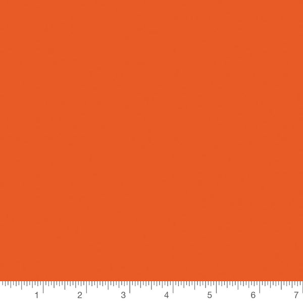 Riley Orange Confetti Cotton Solid by Riley Blake, solid quilting cotton with a ruler for scale