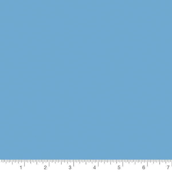 Confetti Cottons solid in Riley Medium Blue by Riley Blake Designs, solid quilting cotton with a ruler for scale