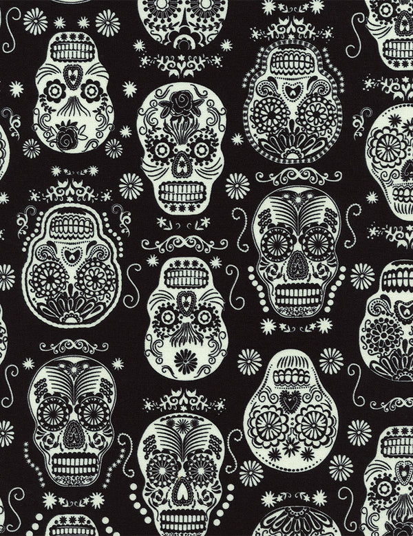 Glow in the Dark Folklore Skulls on Black by Timeless Treasures