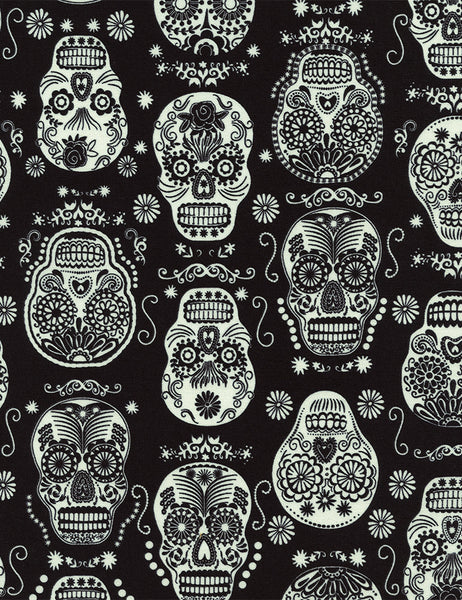 Glow in the Dark Folklore Skulls on Black by Timeless Treasures