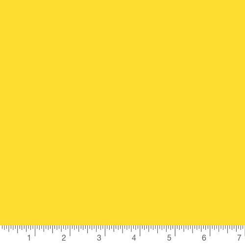 Pure Elements Canary by Art Gallery Fabrics, solid quilting cotton with a ruler for scale