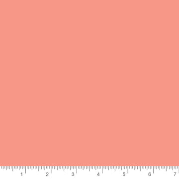 Pure Elements Grapefruit by Art Gallery Fabrics, solid quilting cotton with a ruler for scale