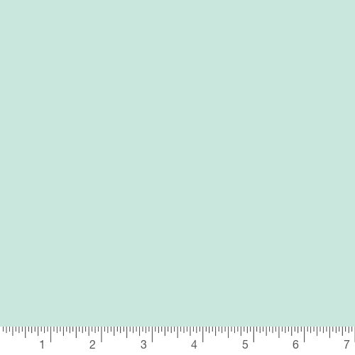Pure Solids in Icy Mint by Art Gallery Fabrics, solid quilting cotton with a ruler for scale