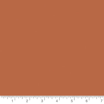 Pure Solids Sienna Brick by Art Gallery Fabrics, solid quilting cotton with a ruler for scale