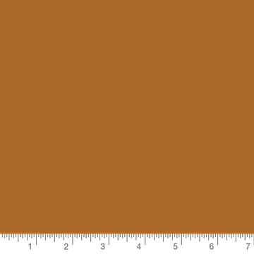 Pure Solids Gingerbread by Art Gallery Fabrics, solid quilting cotton with a ruler for scale