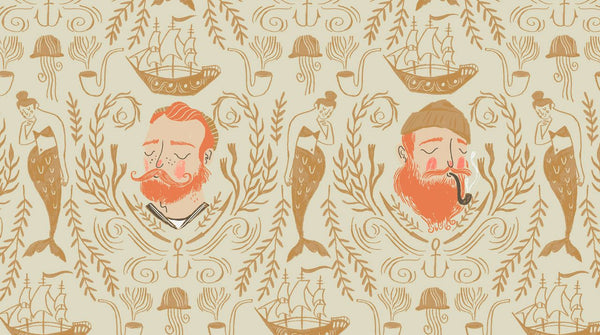 Aweigh North Sailor Toile in Sand by Rae Ritchie for Dear Stella, tan and coral nautical toile with bearded sailors, mermaids, ships and anchors on a cream ground