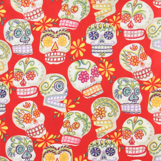 Calaveras Skulls on red by Alexander Henry Fabrics